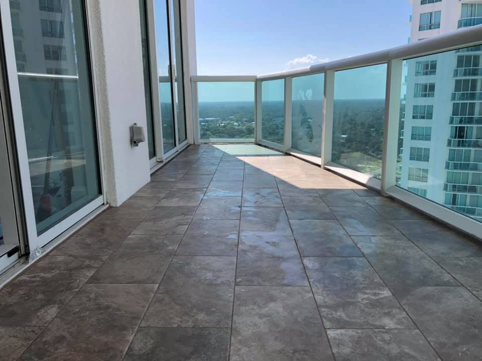 After: tiled high-rise balcony