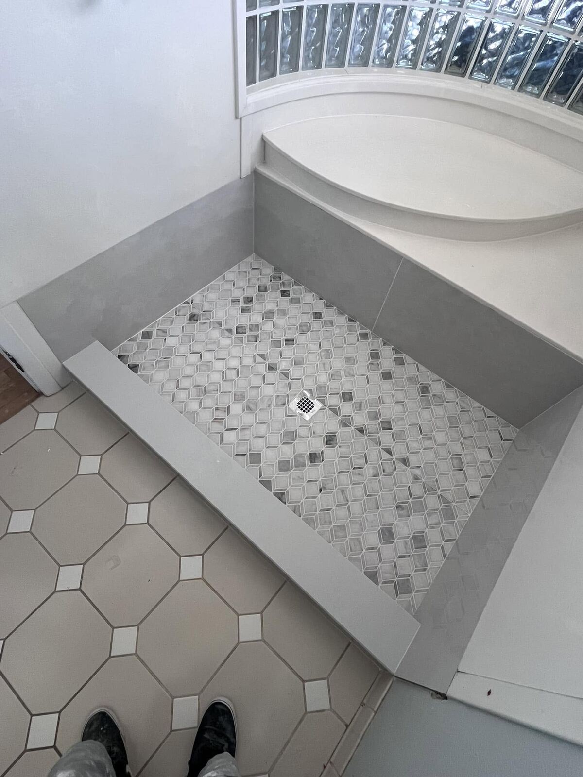 Custom mosaic tile shower pan detail