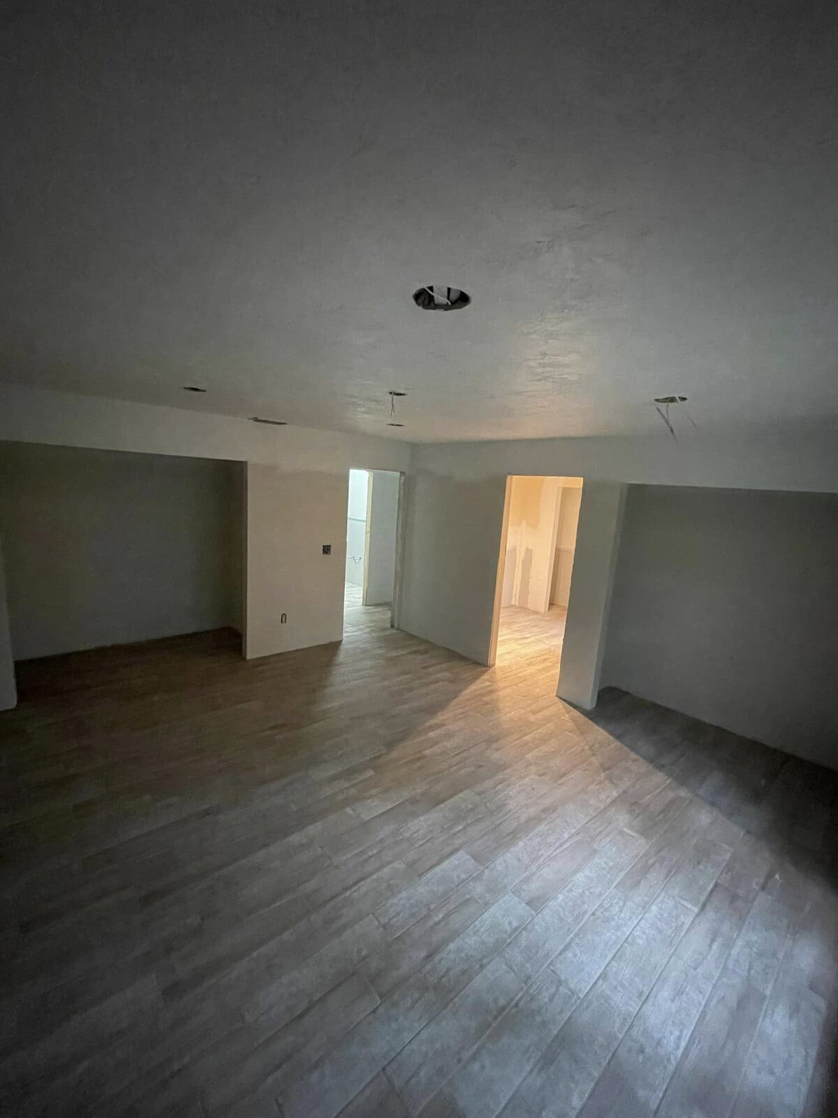 New wood-look tile flooring installed in a room mid-renovation