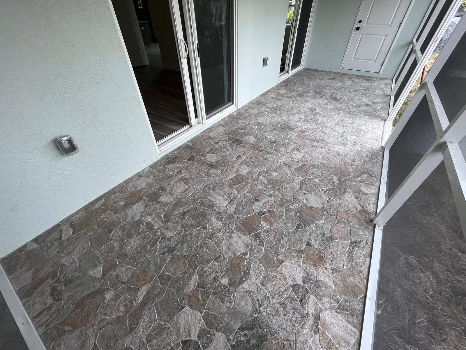 Finished stone-look tile flooring, entry hall