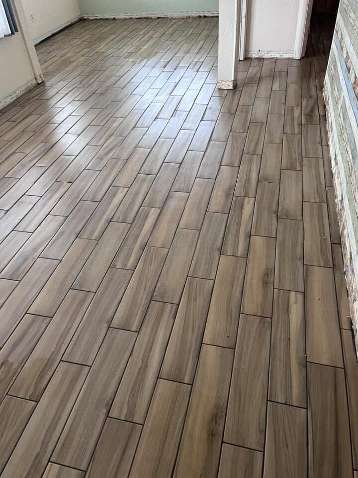 Freshly installed wood-look plank tile flooring